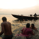 Boatmen setting out at sunrise.